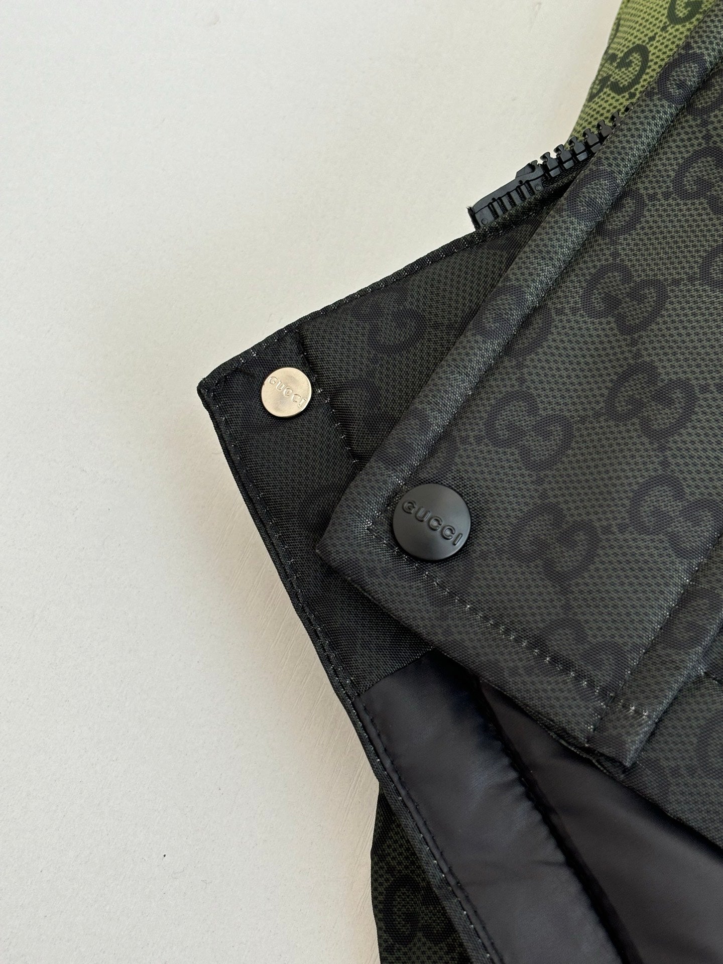 Gucci monogram long puffer jacket cuff with snap button and zipper pull