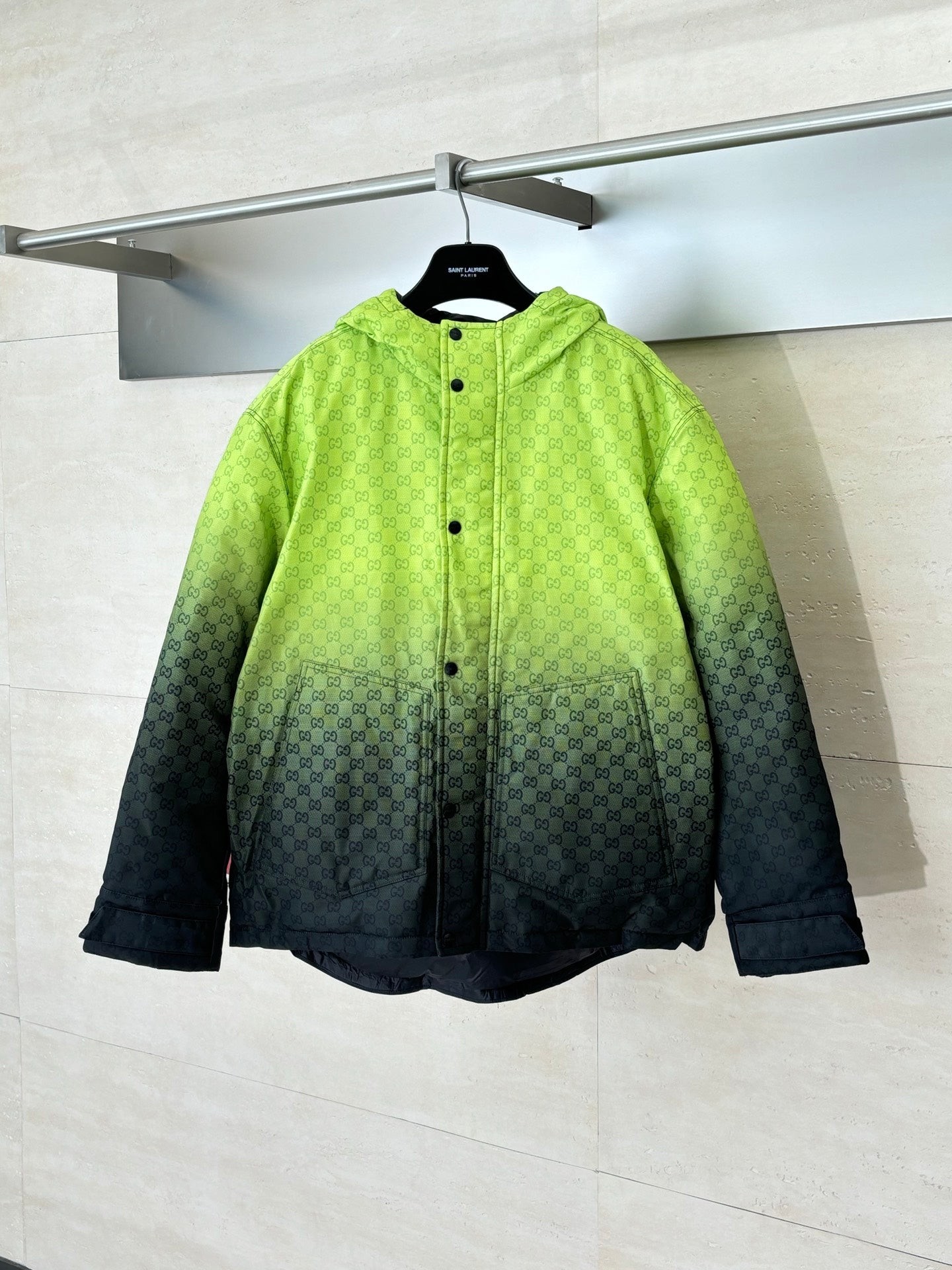 Lime green hooded puffer jacket with dark gradient and button front