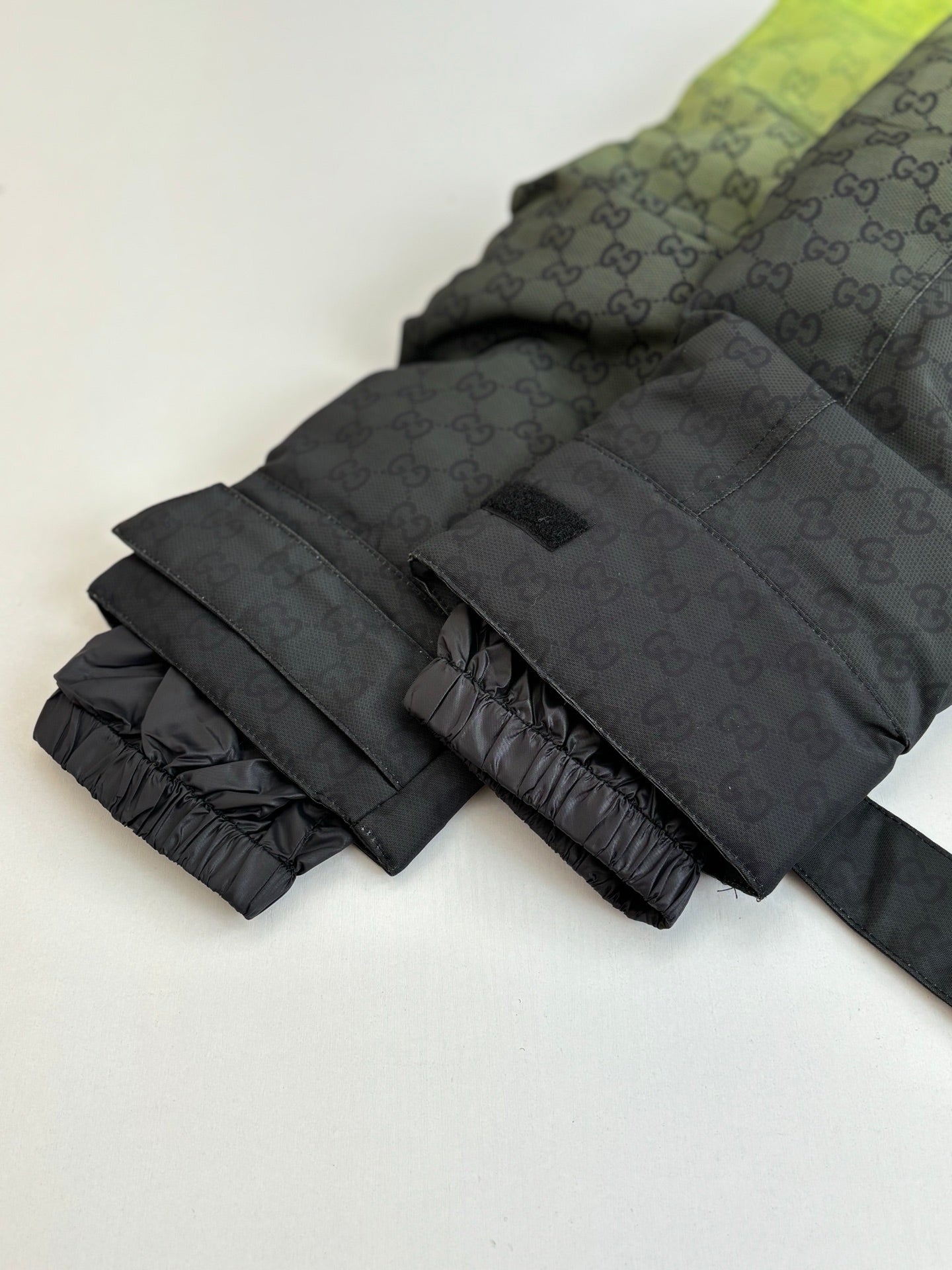 Gucci monogram long puffer jacket sleeve with quilted padding and cuff