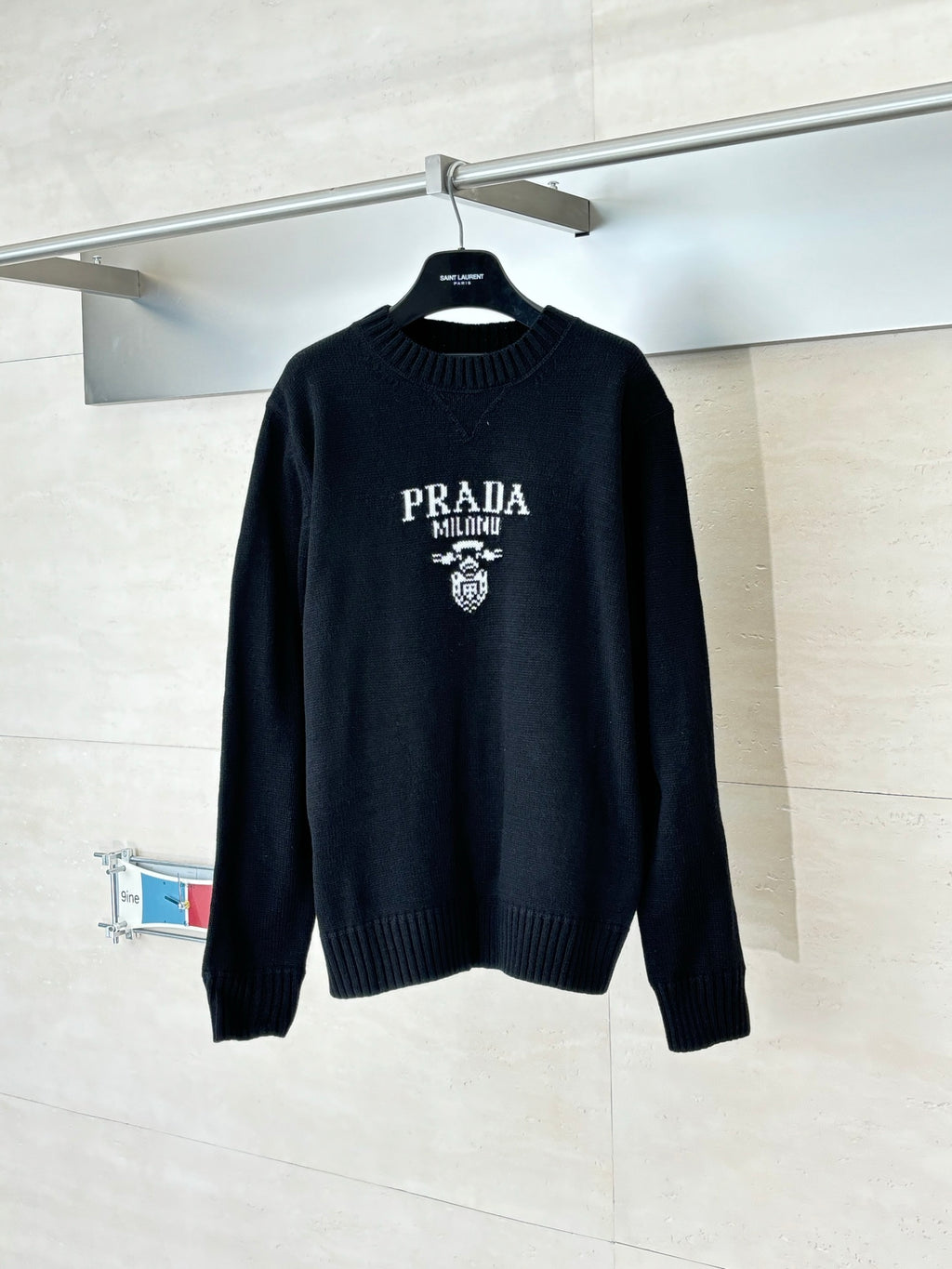 Black long-sleeve crewneck sweater with PRADA MILANO crest logo