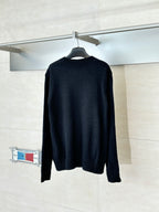 Black long-sleeve crewneck sweater, back view, ribbed hem and cuffs