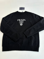 Black knit crewneck sweater with PRADA MILANO logo and crest