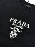 Black knit sweater with PRADA MILANO crest and lettering detail