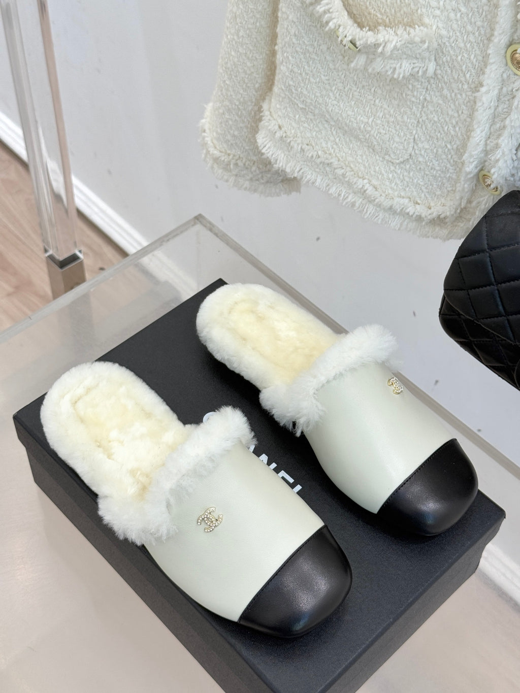 Chanel women's fur slides, cream and black, two shoes on black box