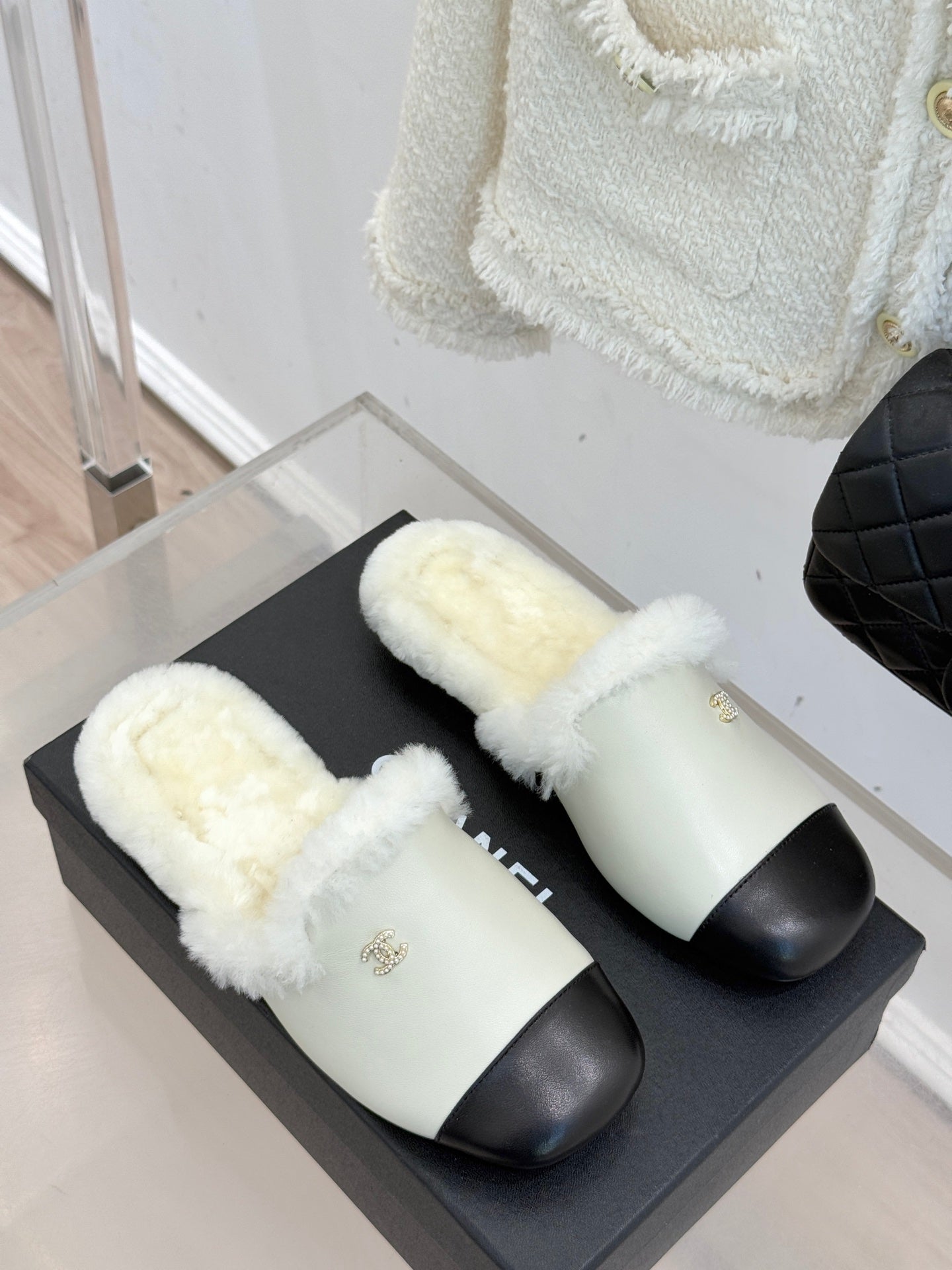 Chanel women's fur slides, cream and black, two shoes on black box