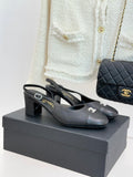 Black leather slingback heels with block heel and CHANEL logo detail