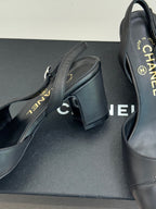 Close-up of black leather slingback heel with CHANEL branding on insole