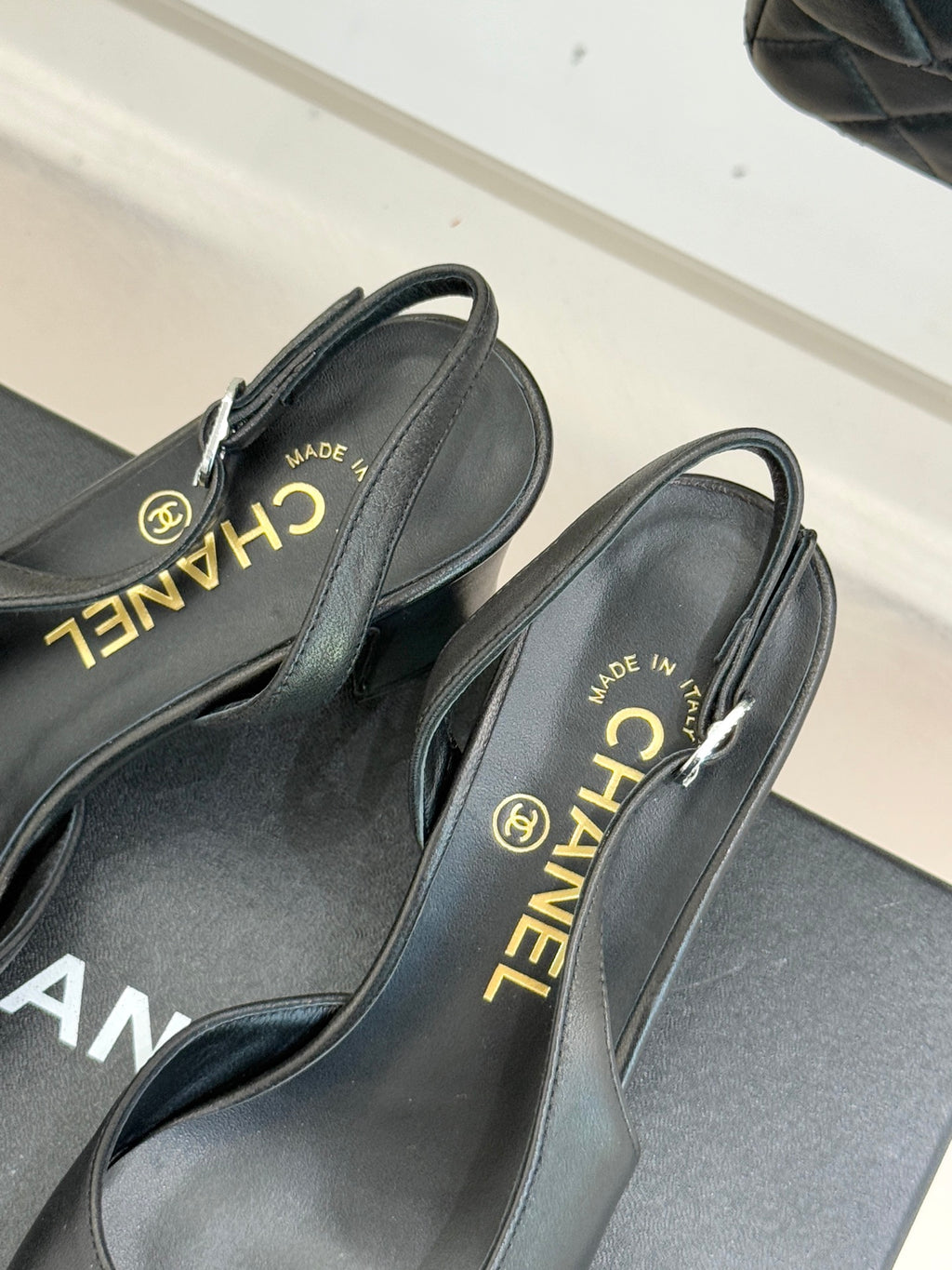 Black leather slingback heels with CHANEL and “MADE IN ITALY” on insoles