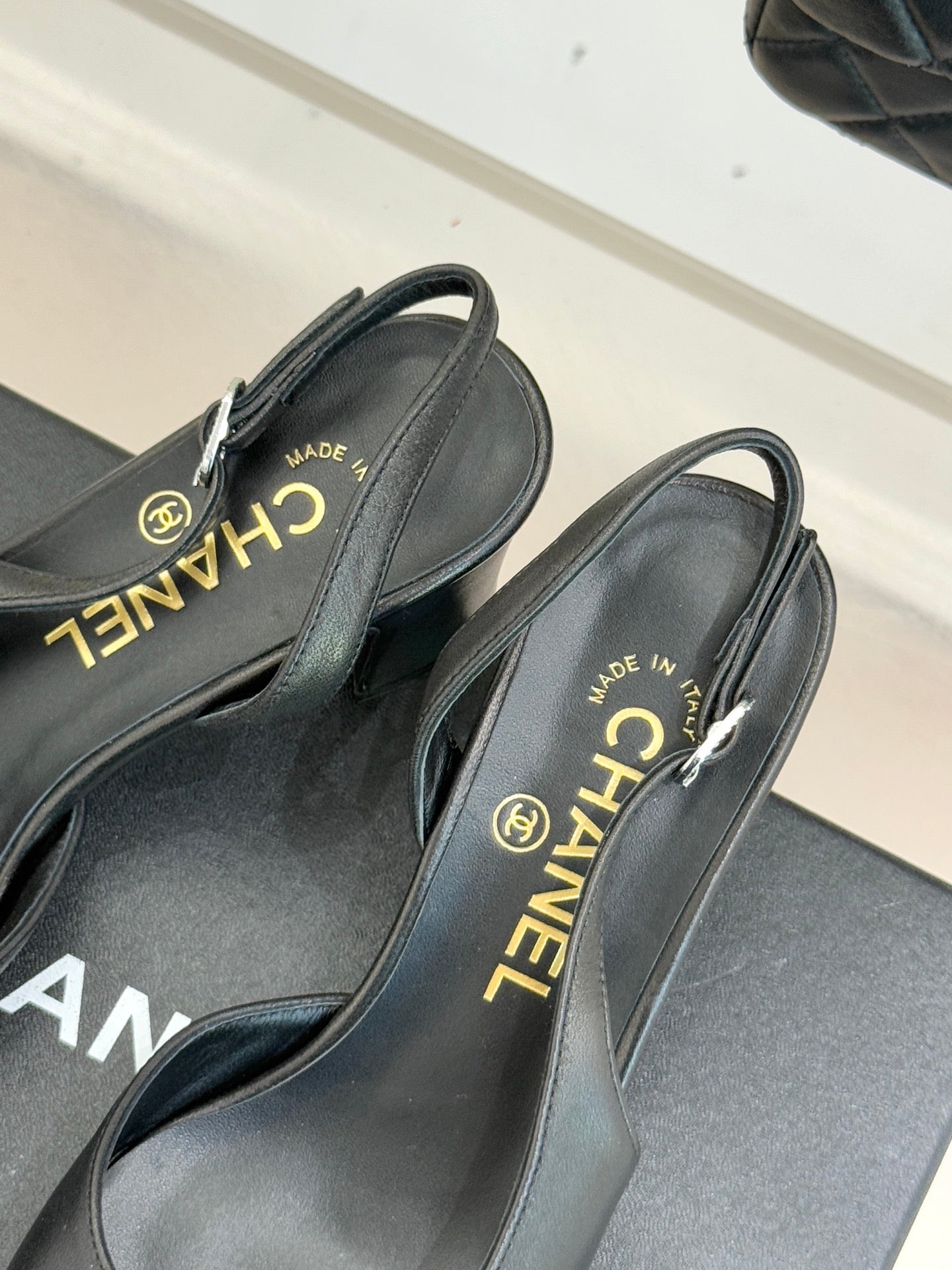 Black leather slingback heels with CHANEL and “MADE IN ITALY” on insoles