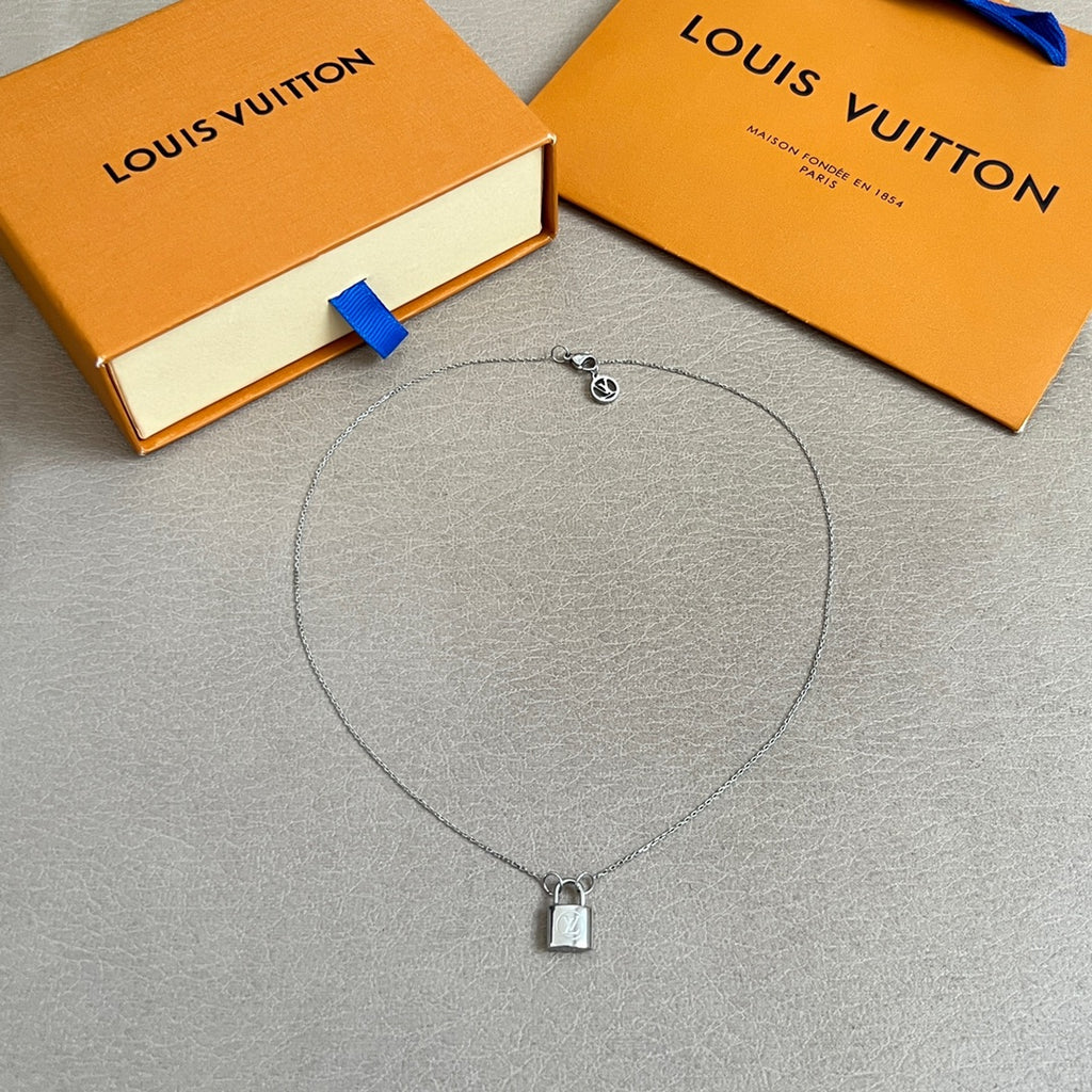 Silver charm necklace with small padlock pendant and chain