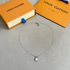 Silver charm necklace with small padlock pendant and chain