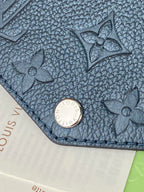 Louis Vuitton bag, blue textured leather with floral pattern and round snap closure