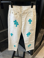 Chrome pants in white with teal cross print, button-front and belt loops
