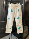 Chrome pants in white with teal cross print, front fly and side pockets