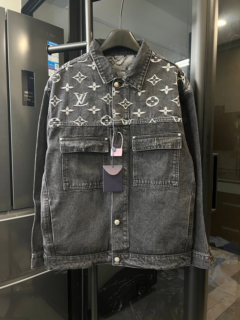 Monogram denim jacket with button front and chest pockets, dark gray with cream Louis Vuitton motifs