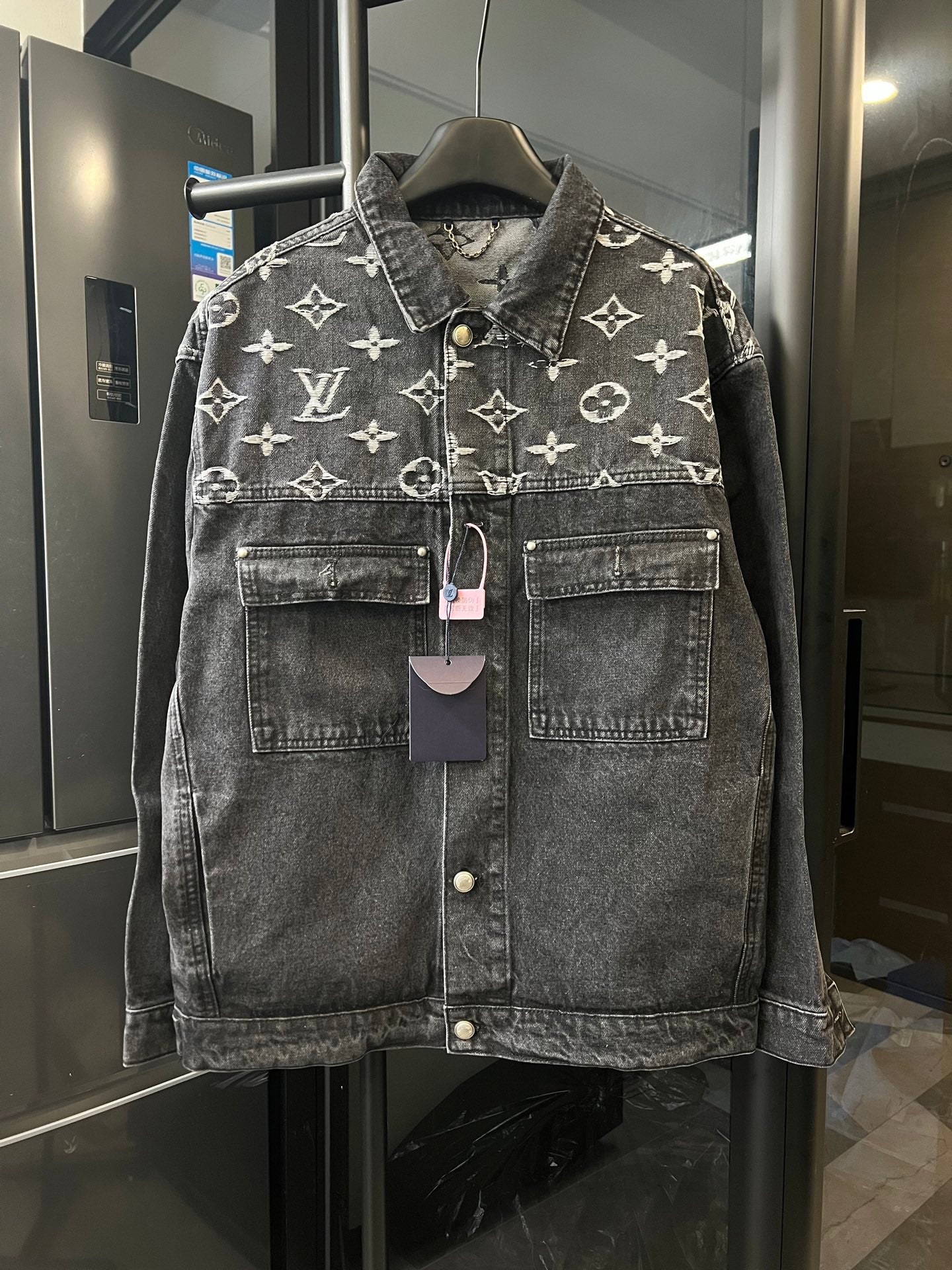 Monogram denim jacket with button front and chest pockets, dark gray with cream Louis Vuitton motifs