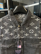 Monogram denim jacket front yoke, button placket and chest pockets, dark gray with cream motifs