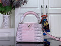 Louis Vuitton pink croc-embossed handbag with top handles and long shoulder strap