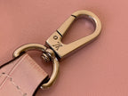 Louis Vuitton pink leather key fob with gold-tone metal clasp and rings