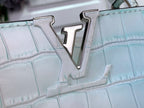 Crocodile-embossed handbag with polished metal V logo emblem on front panel