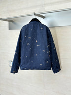 Navy Louis Vuitton jacket back view with allover monogram and rider motif