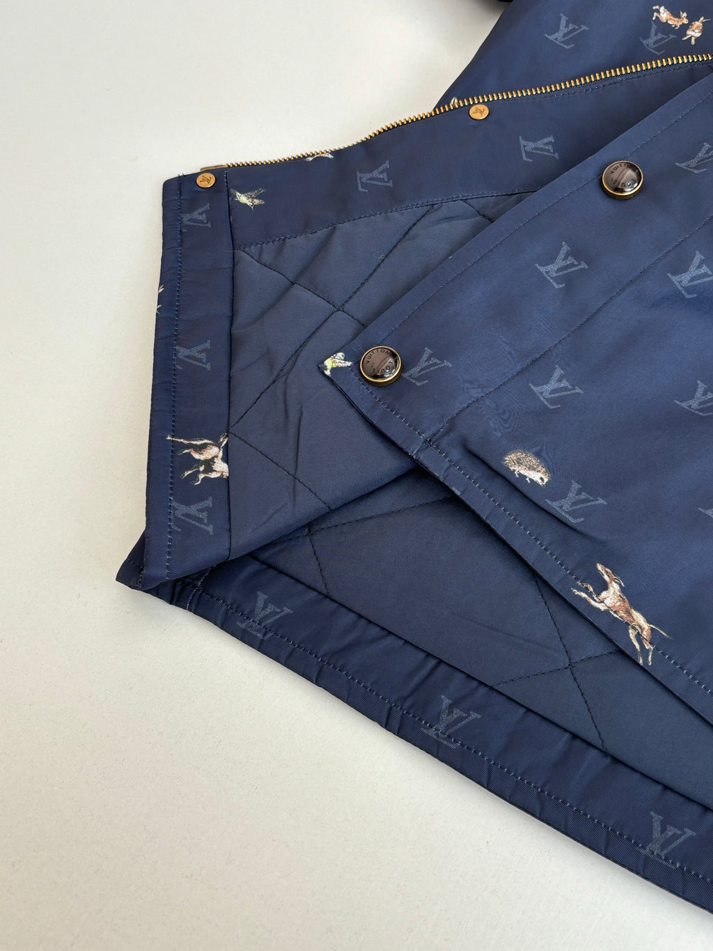Navy Louis Vuitton jacket with quilted lining and diagonal seam stitching