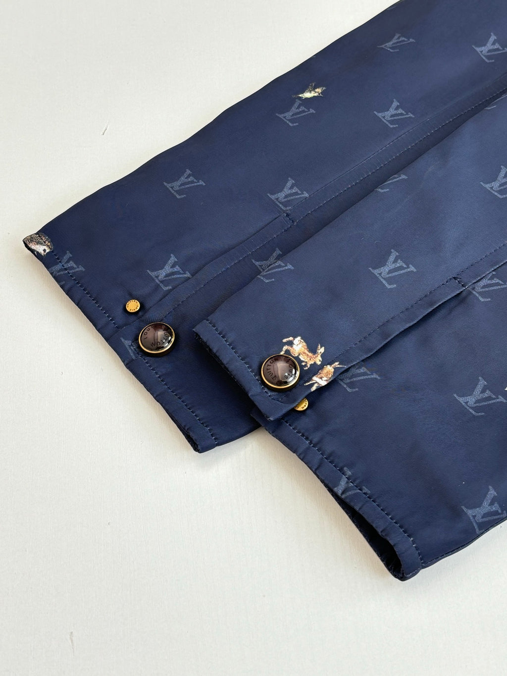 Louis Vuitton dark blue quilted jacket with monogram pattern and buttoned flap cuff