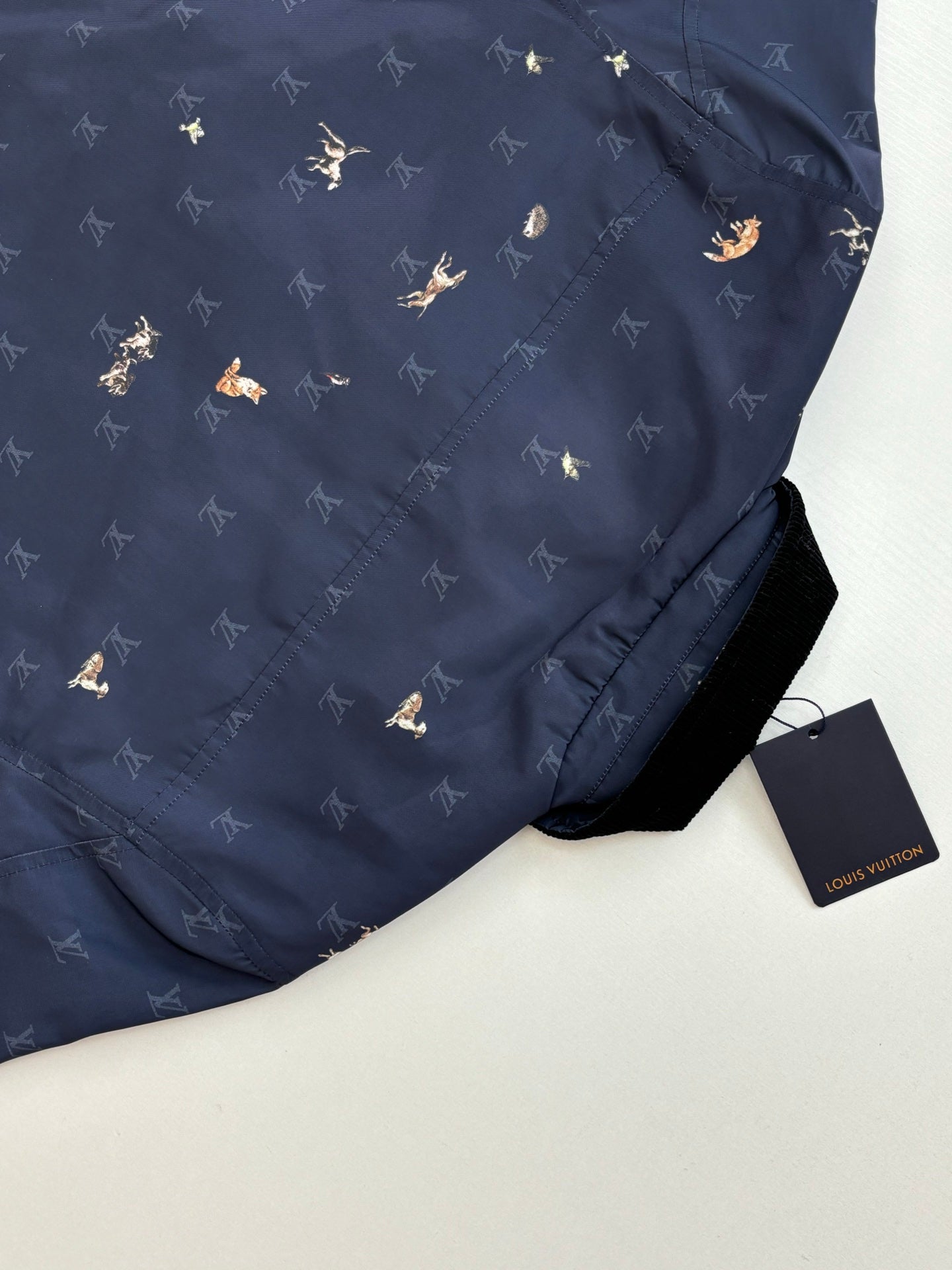 Navy Louis Vuitton jacket back section with allover monogram pattern