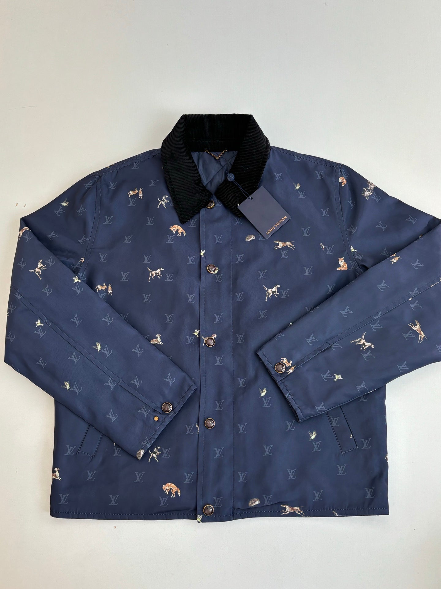 Navy Louis Vuitton jacket front with button-up placket and stand collar