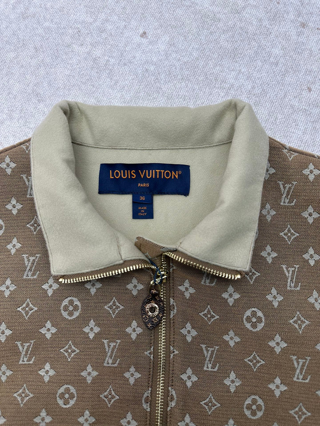 Zip-front monogram jacket with light-beige collar and metal zipper pull