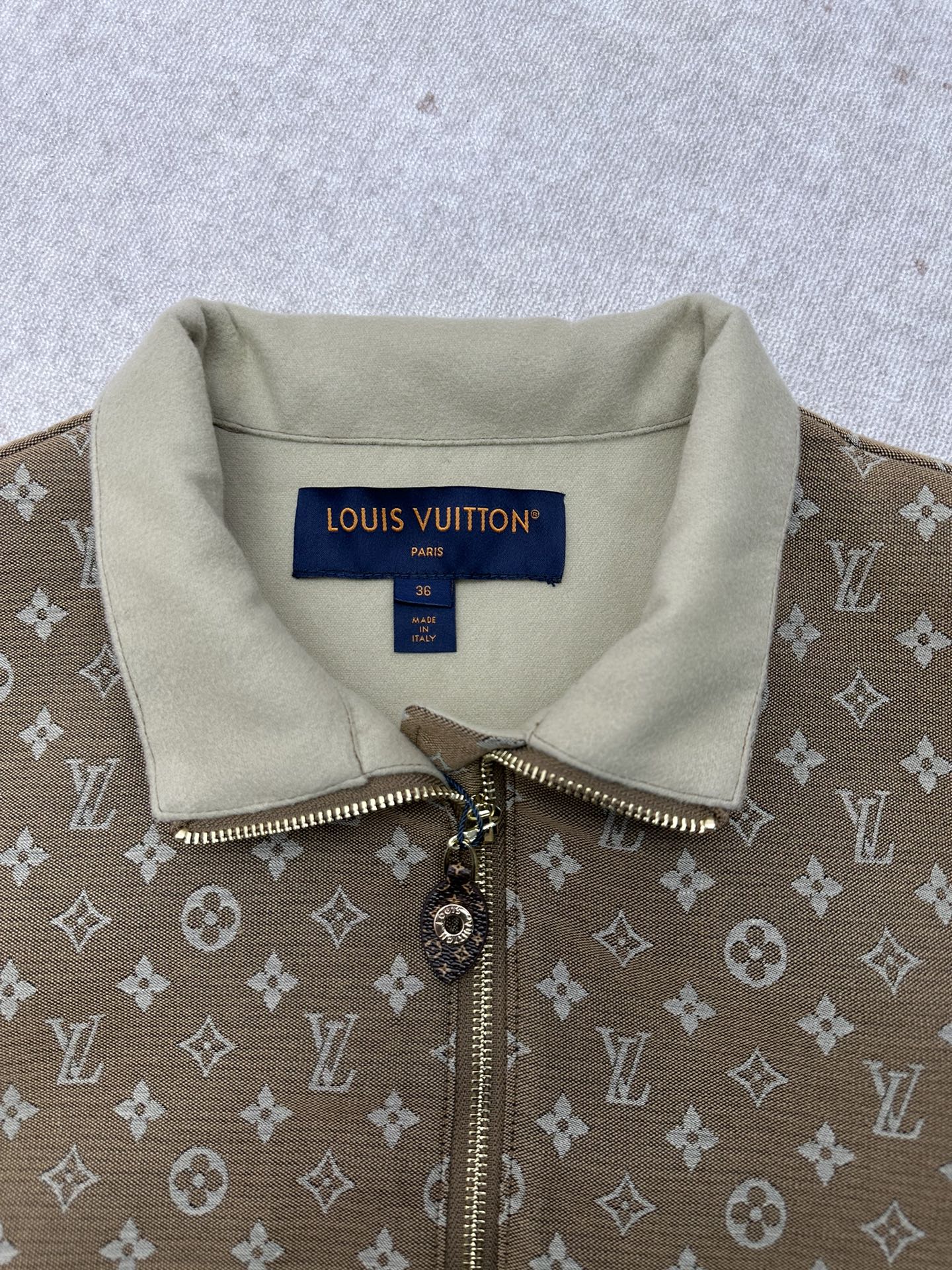 Zip-front monogram jacket with light-beige collar and metal zipper pull