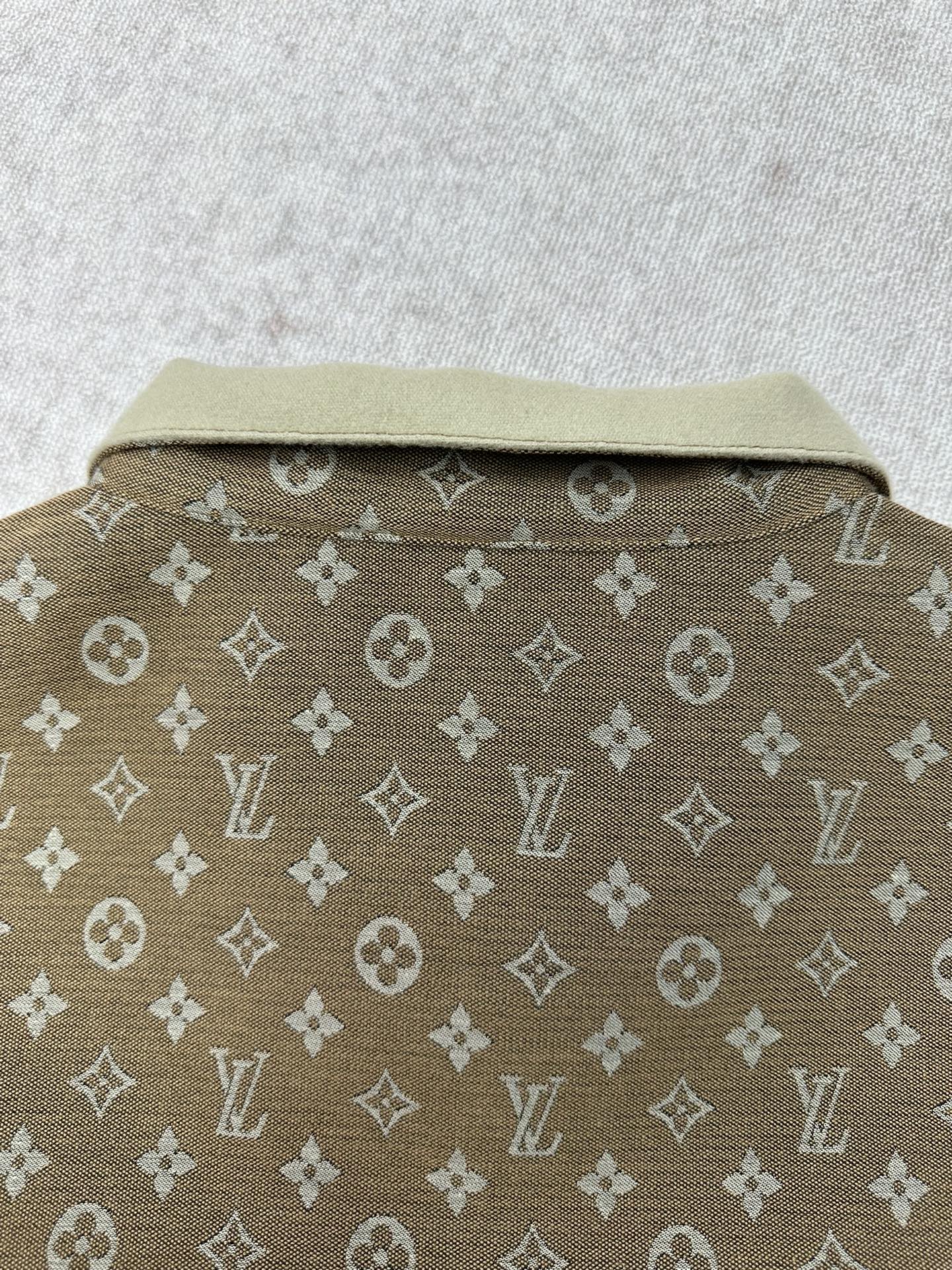 Monogram jacket back view with light-beige stand collar