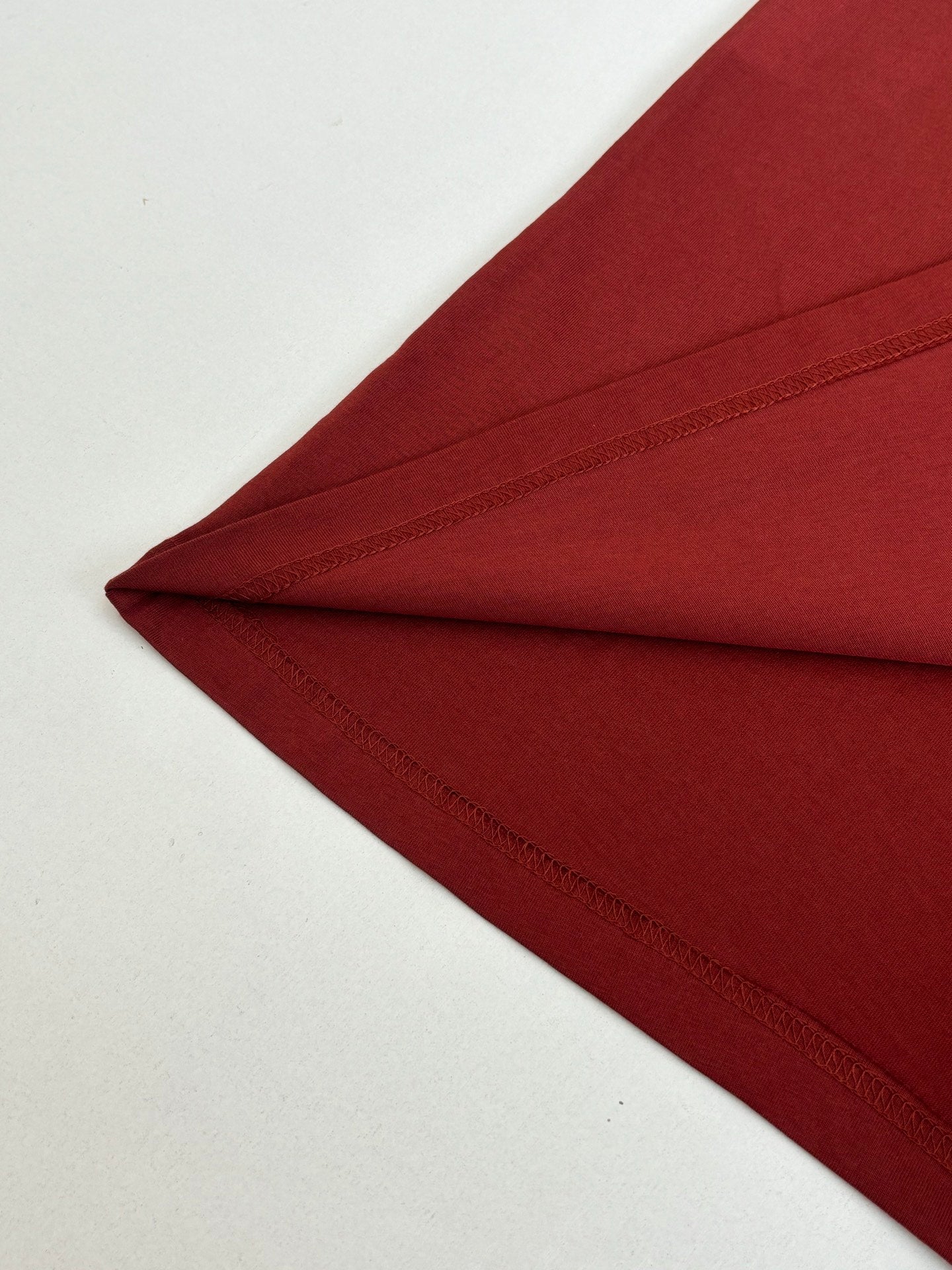Dior red T-shirt hem and stitched edge detail