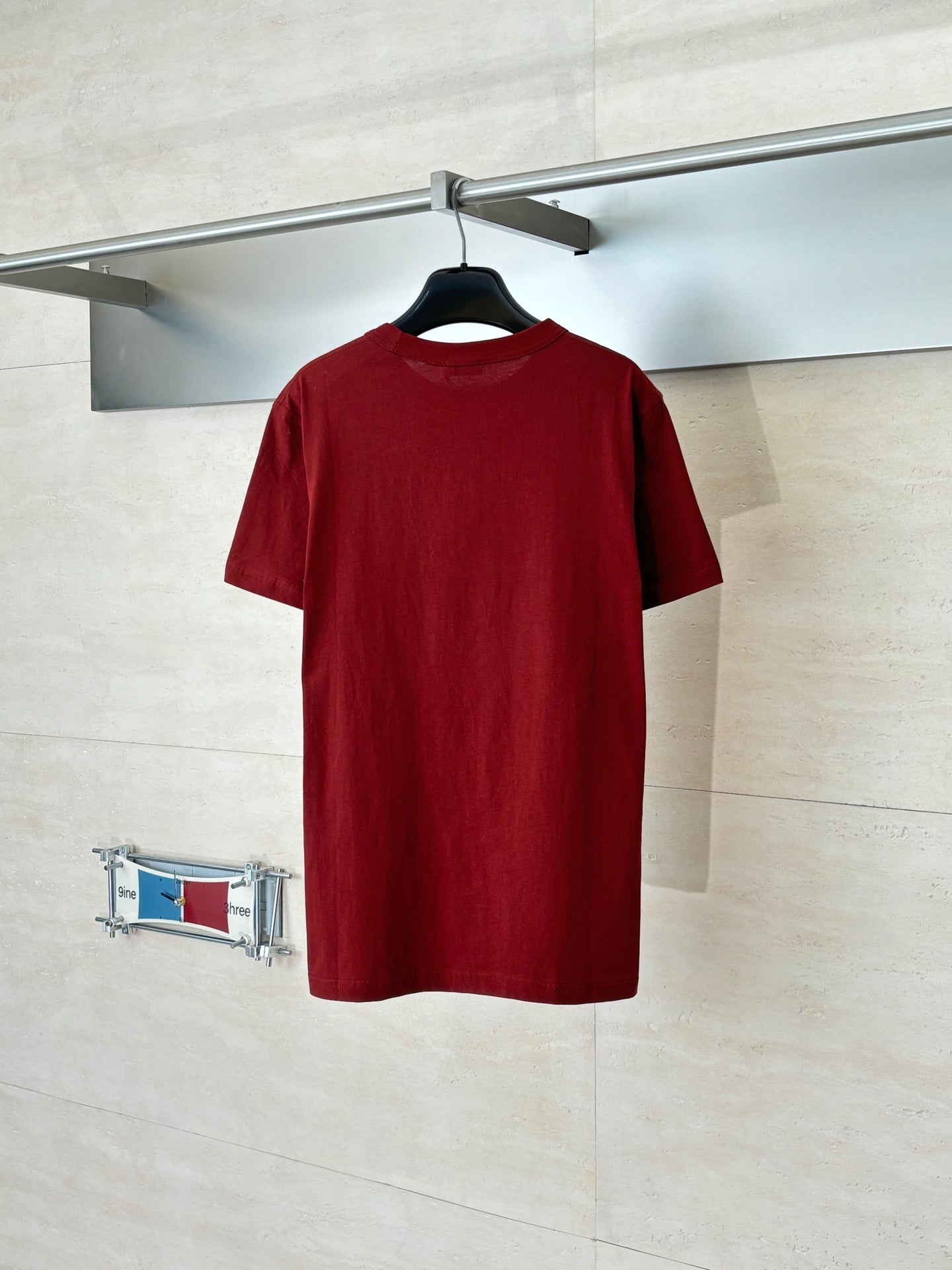 Dior red short-sleeve T-shirt on hanger, plain back view
