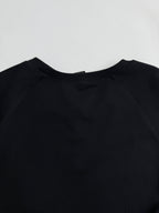 Black raglan-style crewneck sweatshirt with smooth neckline seam