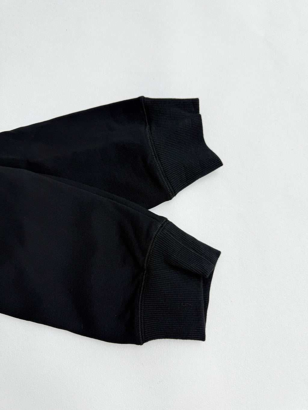 Black long-sleeve sweatshirt sleeve cuff and ribbed hem