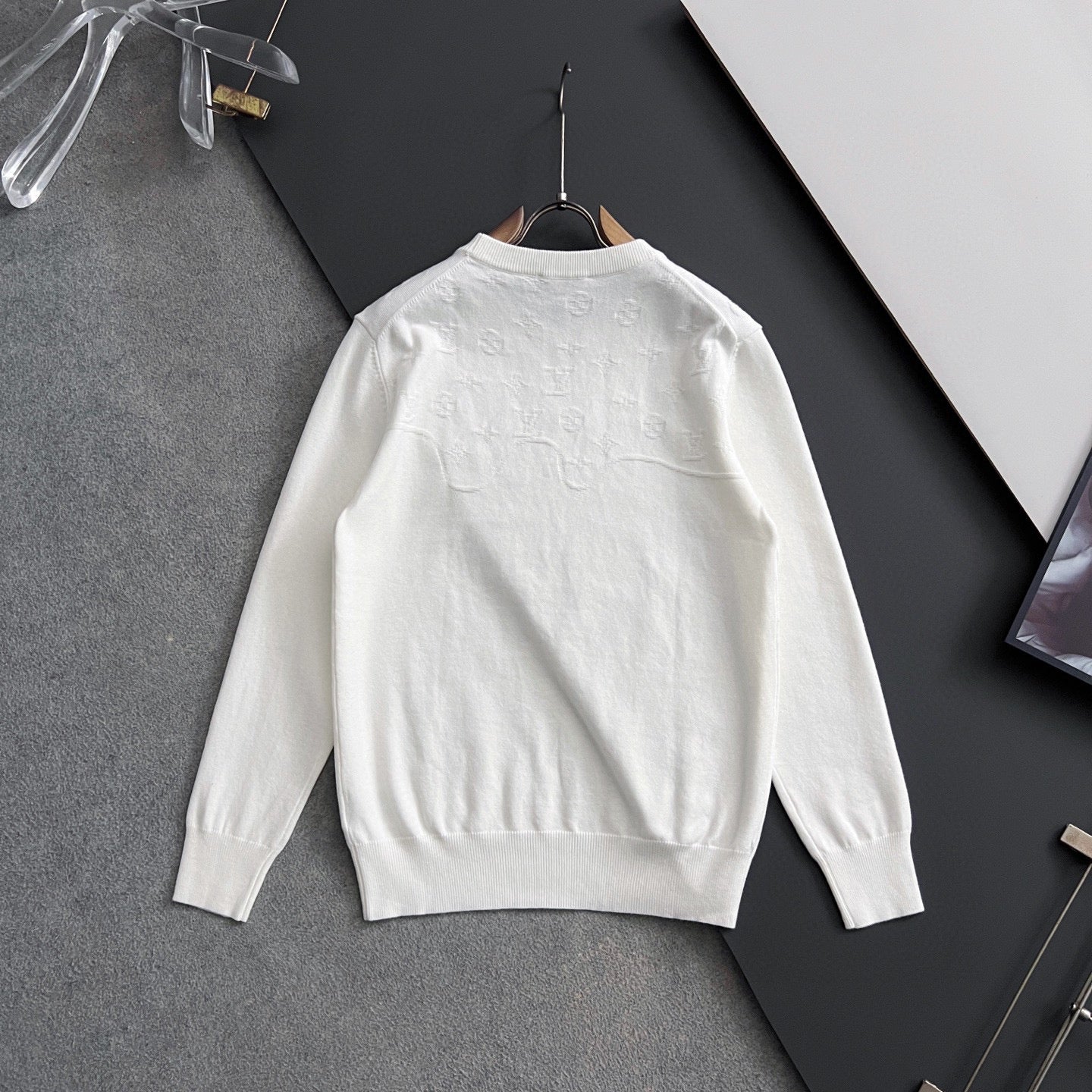 White Louis Vuitton long-sleeve crewneck sweatshirt on hanger, back view