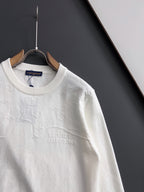 White Louis Vuitton long-sleeve crewneck sweatshirt on hanger, close front view