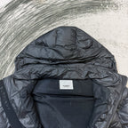 Dark puffer jacket interior view with Burberry logo label