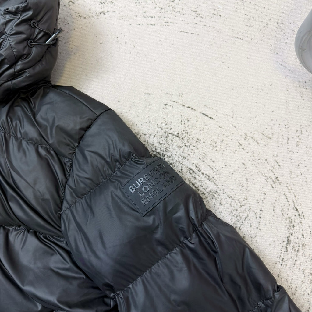 Dark puffer jacket back with Burberry LONDON logo patch