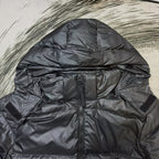 Dark puffer jacket with front zipper and adjustable cuffs