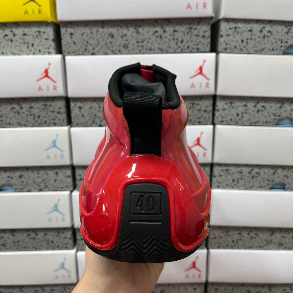 Red glossy high-top sneaker heel with black outsole tread and “40” detail