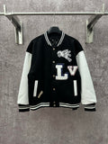 Black long varsity jacket with white sleeves, ribbed collar and button front