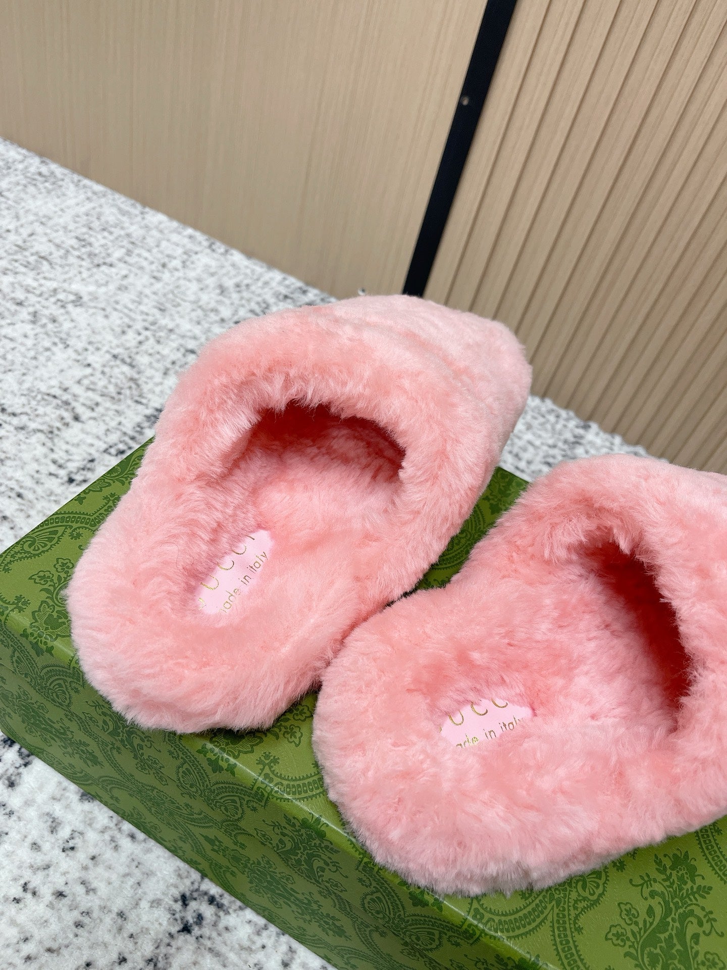 Gucci pink plush slide sandals showing cushioned open-toe footbed