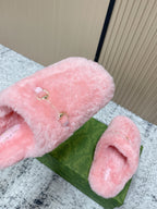 Gucci pink plush slide sandals with gold-tone buckle hardware and open toe