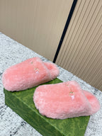 Gucci pink plush slide sandals, two wide fur-like straps with gold-tone buckles