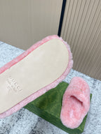Gucci pink plush slide sandals with inner lining showing small printed branding