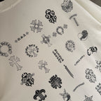 White T-shirt fabric with printed icons pattern, crewneck edge visible