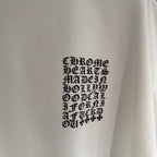 Close-up of white T-shirt chest graphic in black lettering
