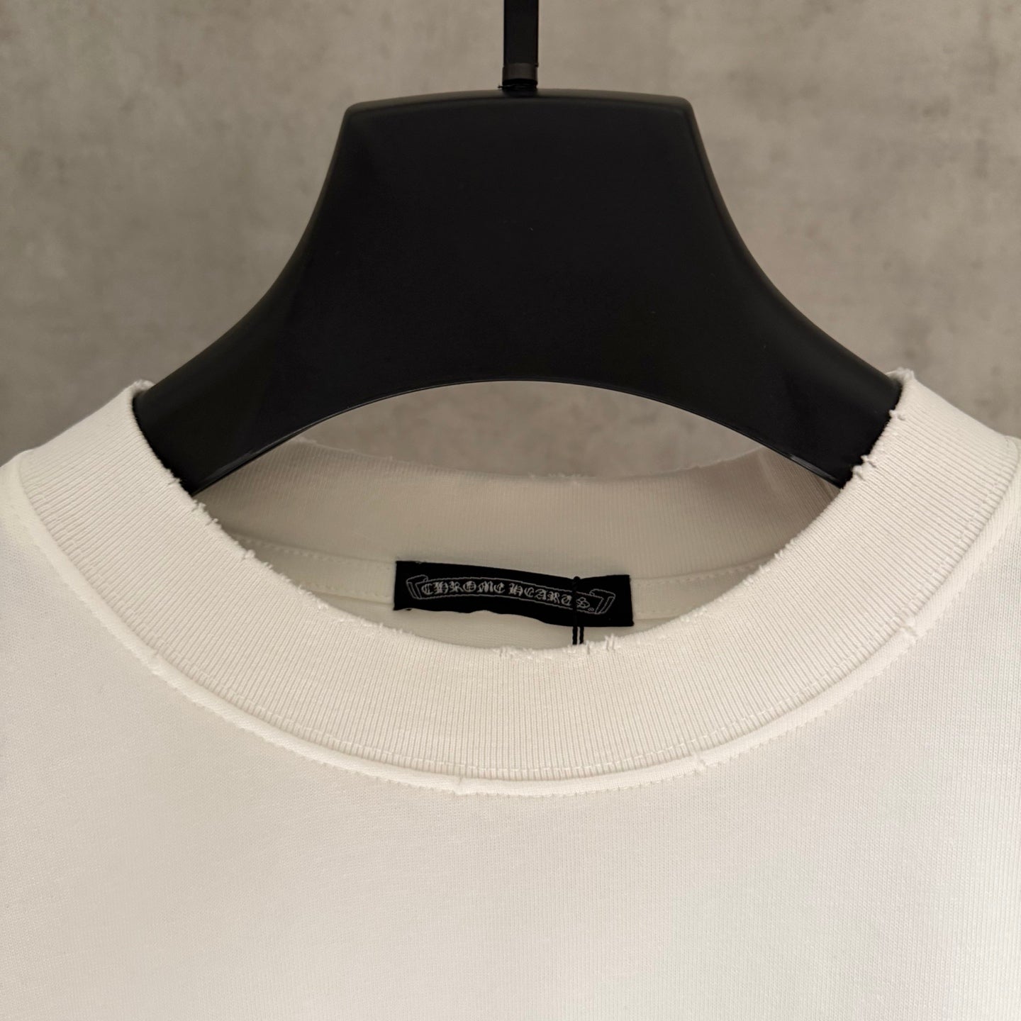 White crewneck short-sleeve T-shirt with ribbed collar and inner neck label